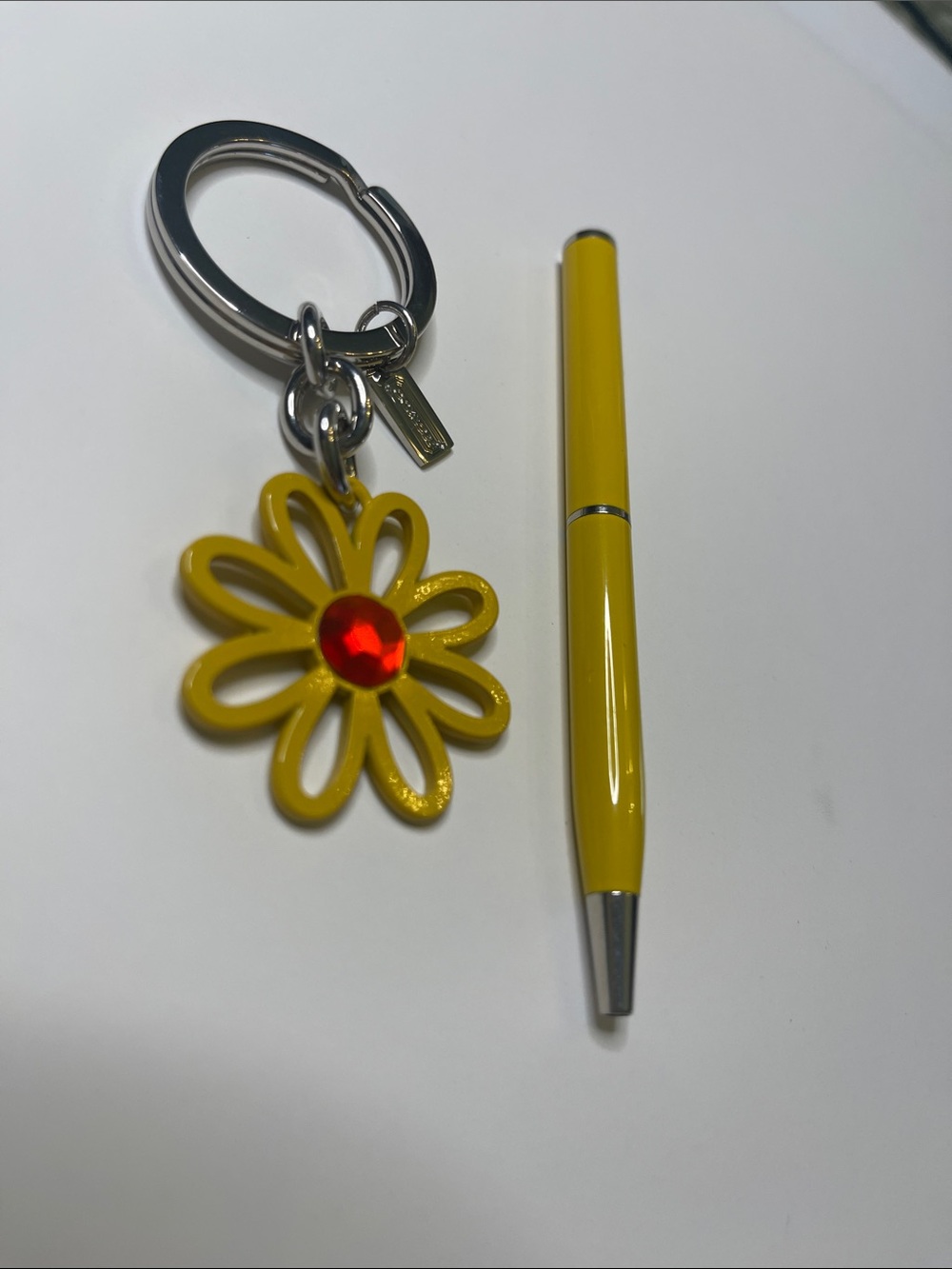 Coach Yellow Daisy Keychain with Red Center and Yellow Coach Pen - Picture 2 of 8